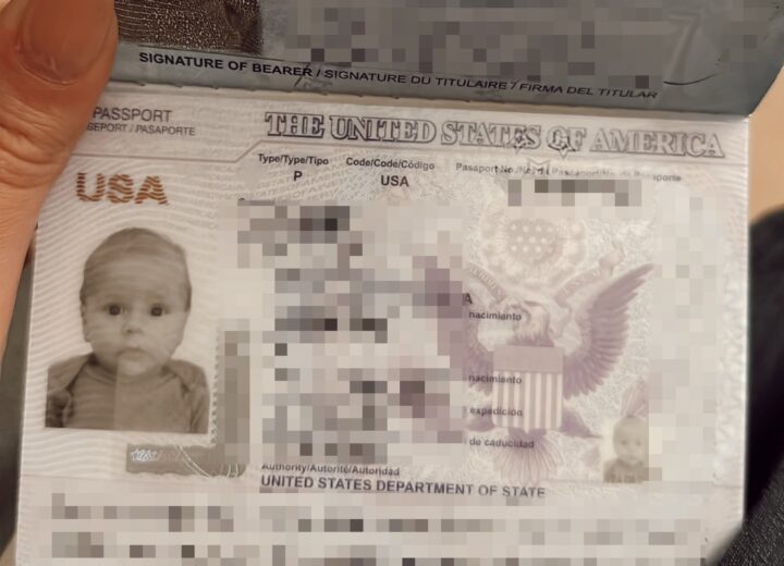 Close up image of baby's first passport with essential details blurred