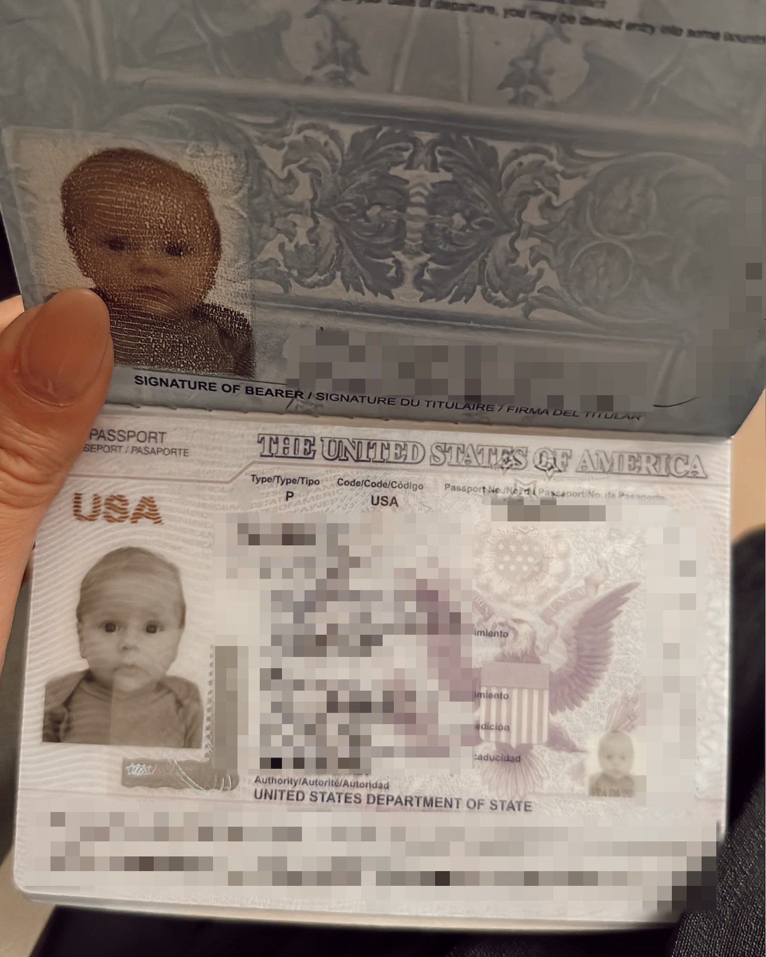 Close up image of baby's first passport with essential details blurred