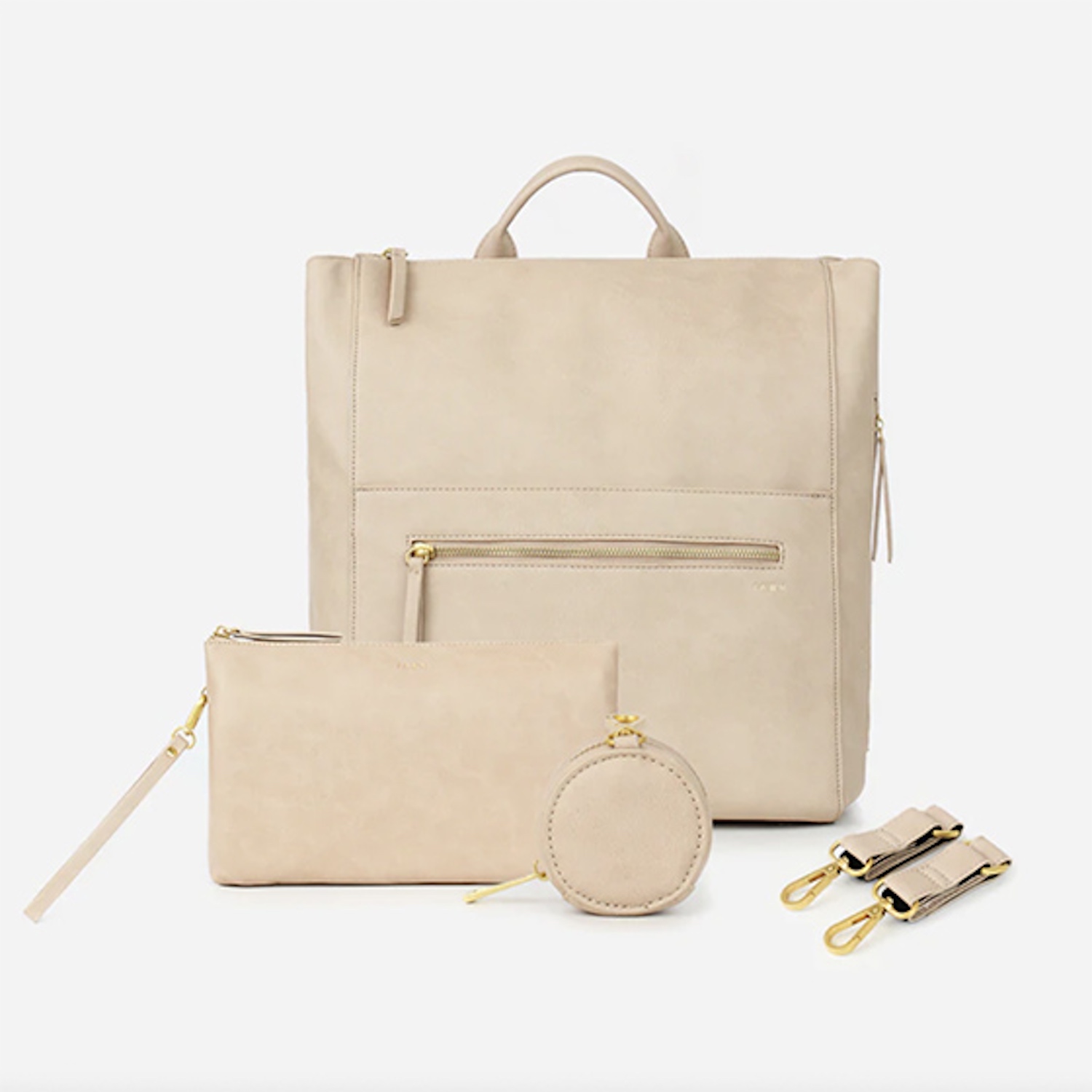 product image of beige tall diaper bag with zipper pouch and accompanying rectangle pouch and circular pocket pouch with keyholders